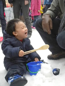 Little boy playing in the snow in Berkeley